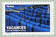 Image du timbre Échevaux teints en bleu séchant
